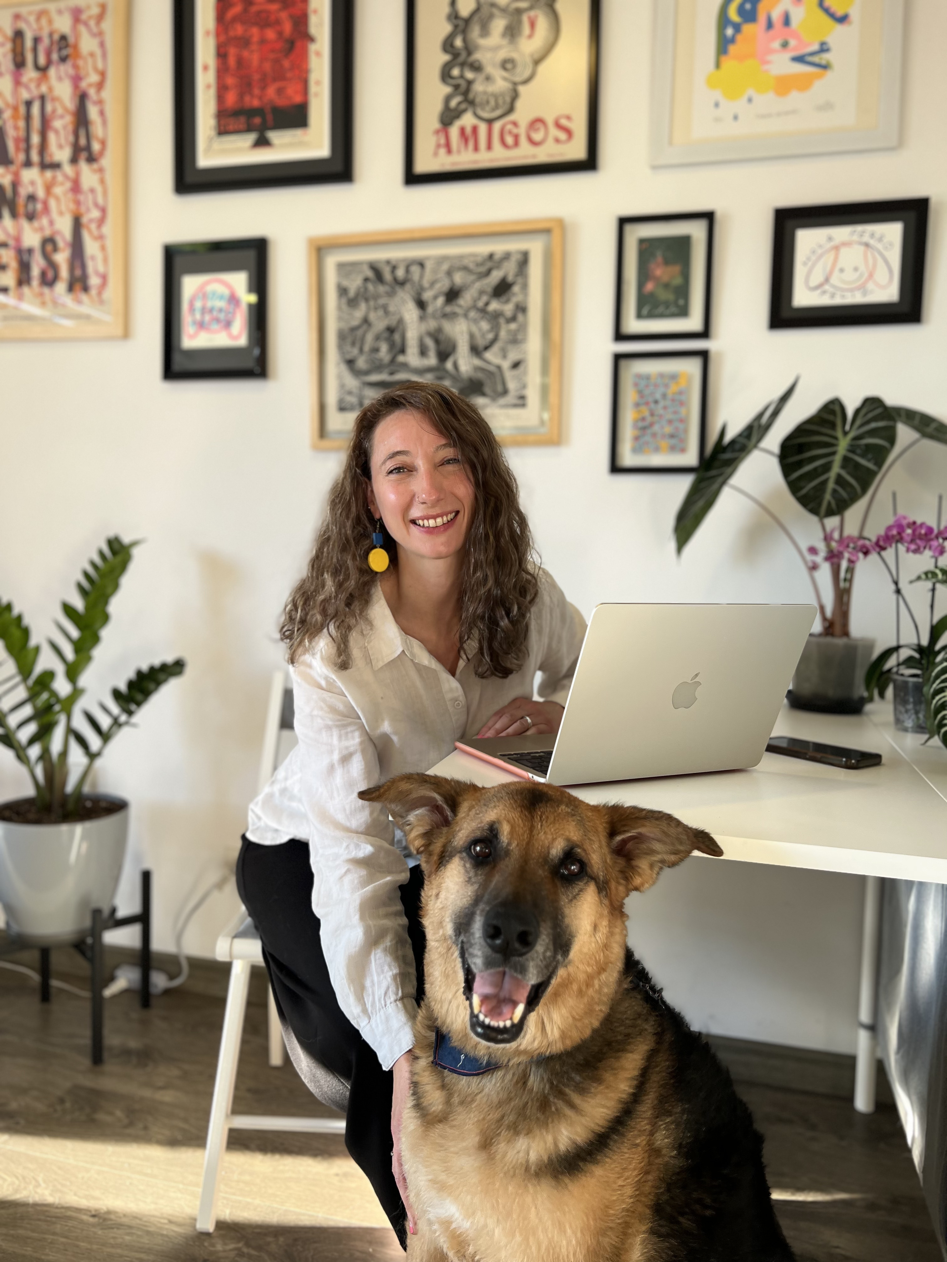 Lydia Simmonds working at her desk with her dog