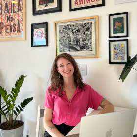 Lydia Simmonds smiling at her desk